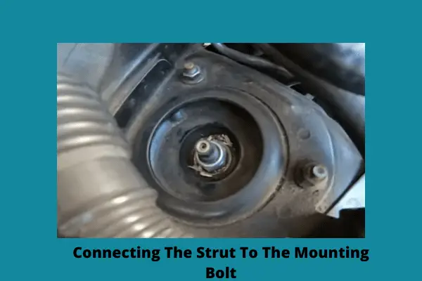 connecting the strut to the mounting bolt
