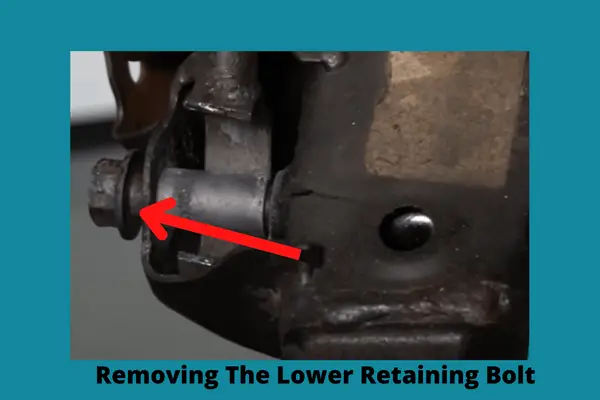 removing the lower retaining bolt