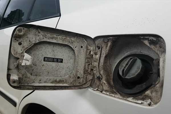 dirty fuel filler flap