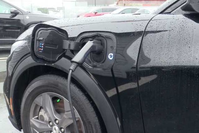 charging an electric car in rain